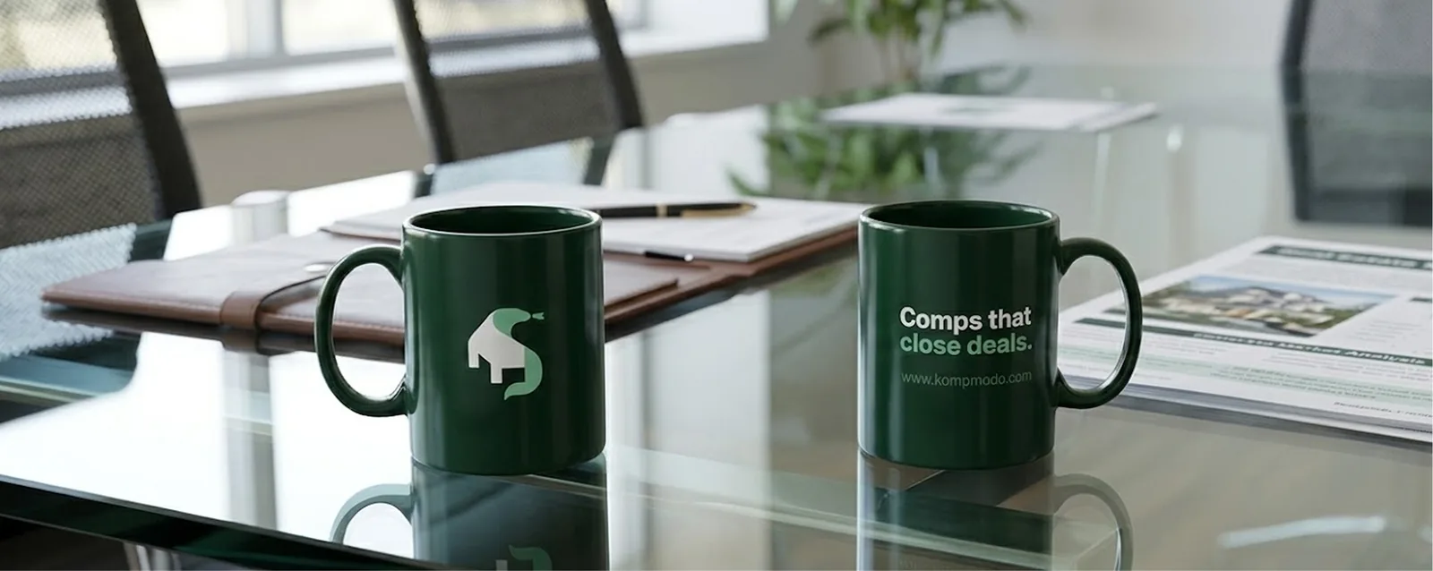 Kompmodo mugs on an office desk